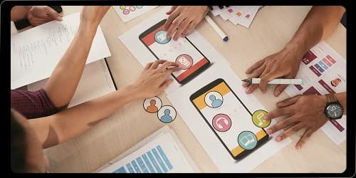 Workshop team mapping UX strategy insights